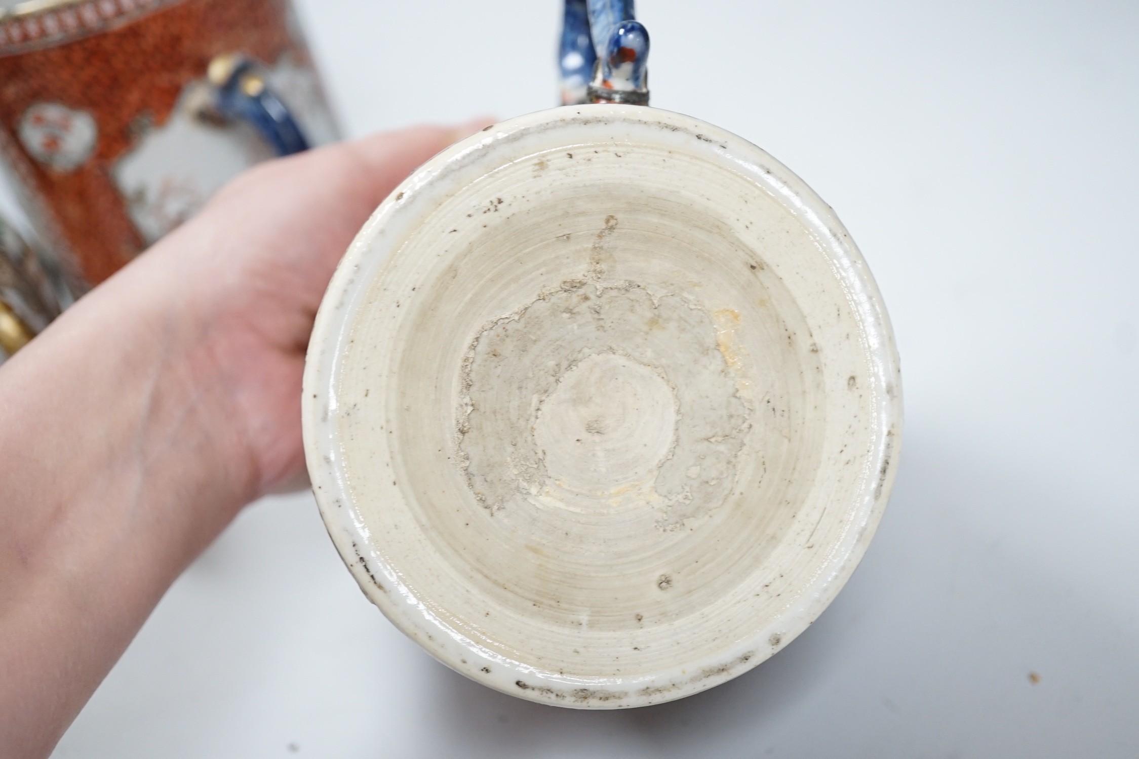 Two Chinese export 'mandarin' mugs and a similar teapot, Qianlong period, tallest mug 14cms high